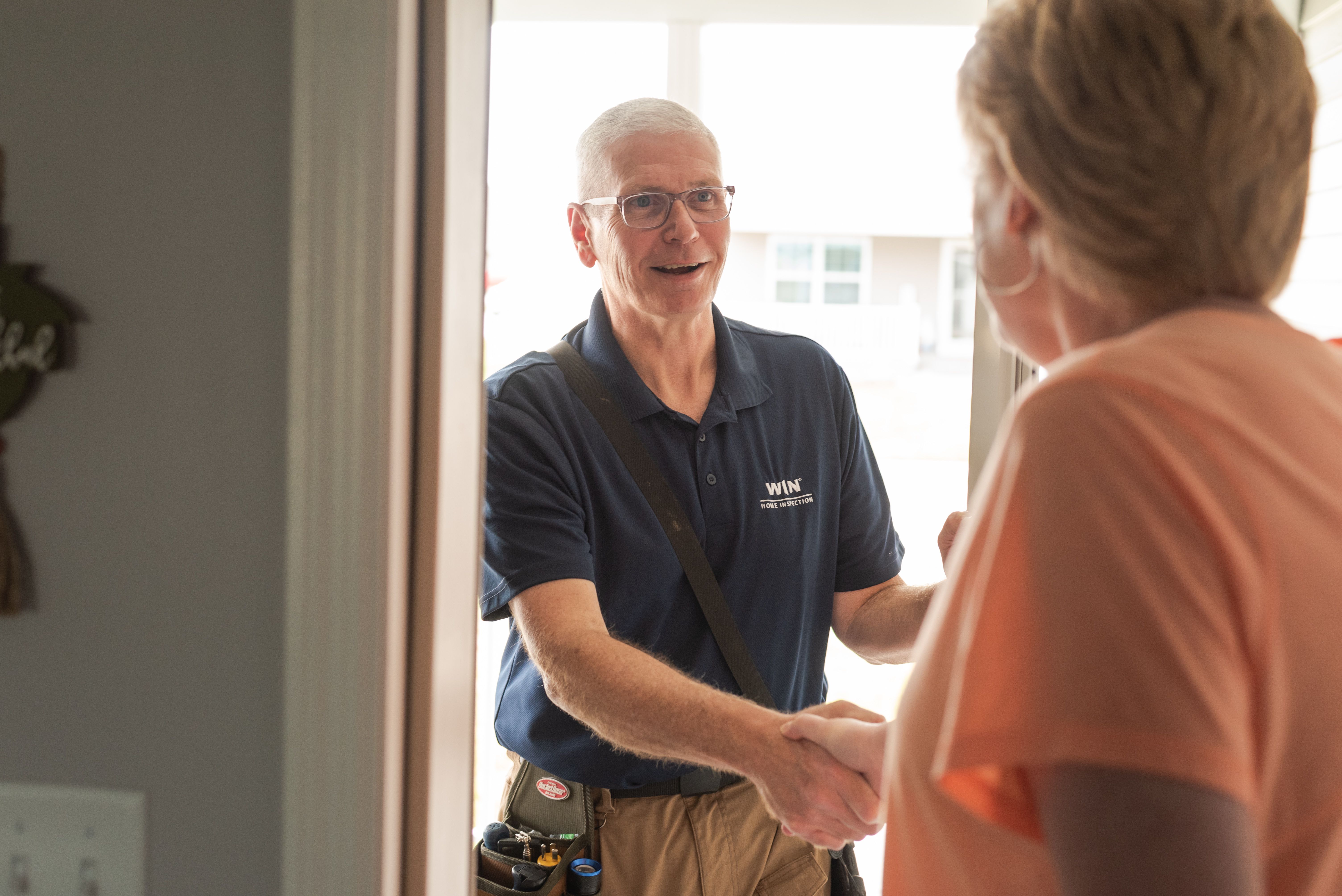 WIN Home inspector meeting his client